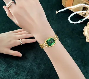 Detail view of CURREN 9093 women's square watch featuring a green dial and gold band