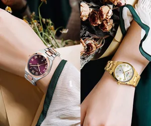 Close-up detail of CURREN women's quartz watches with Roman numeral dials and steel bands.