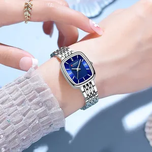 Close-up detail of CURREN 9093 women's square watch with blue dial worn on the wrist