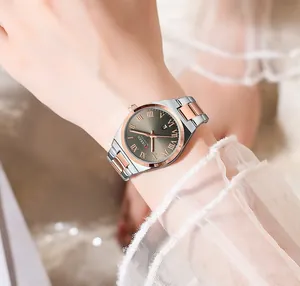 Elegant CURREN women's quartz watch with Roman numerals shown on a model's wrist
