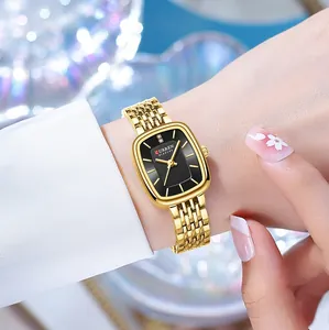 Elegant close-up of CURREN gold square watch for women on wrist with a black dial