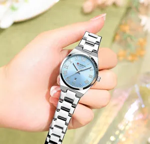 Elegant detail view of CURREN women's silver watch with blue dial and Roman numerals on hand.
