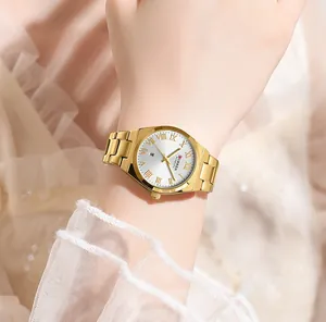 Close-up of CURREN gold women's watch with white dial and Roman numerals
