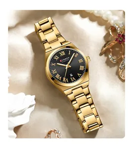 Close-up of CURREN 9095 ladies gold quartz watch with black dial and Roman numerals