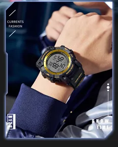 Close-up of SMAEL digital sports watch with gold bezel and black strap on wrist