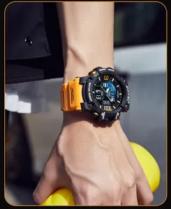 Makro-Detailansicht der wasserdichten SMAEL-Sportuhr mit lebhaftem orangefarbenem Armband