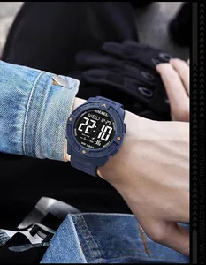 Detailed view of SMAEL men's blue digital sports watch with LED display on wrist.