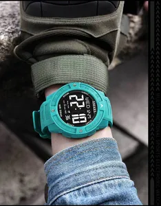 Close-up view of SMAEL men's teal digital sports watch with LED backlight