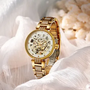 FORSINING Damen-Automatikuhr mit Skelett-Zifferblatt und Strasssteinen in Gold.