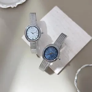 Elegant quartz watches with silver mesh straps and white or blue sunburst dials.
