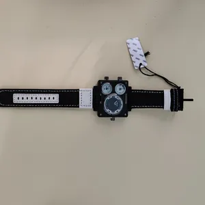 Close-up view of a men's square sports watch with triple dials and canvas strap
