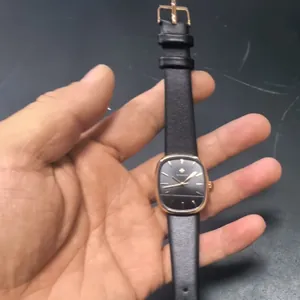 WWOOR vintage women's watch with rectangular rose gold case and black leather strap