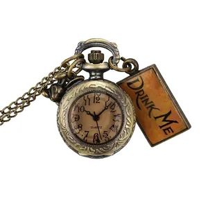 Vintage Alice in Wonderland bronze quartz pocket watch with a Drink Me tag and chain