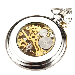 Silver mechanical pocket watch showing intricate internal gears and craftsmanship.