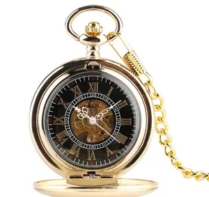Detailed close-up of a vintage gold-toned mechanical pocket watch with skeleton dial
