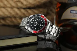Close-up of WINNER automatic mechanical men's watch with steel band and red bezel
