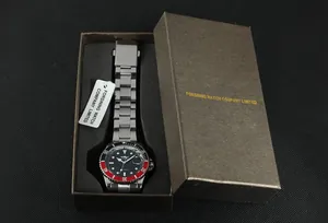 Winner automatic mechanical watch detail with stainless steel strap and red black bezel