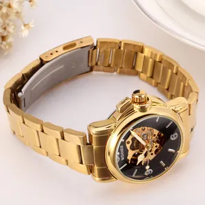 Detail view of women's luxury gold skeleton automatic mechanical watch with steel band