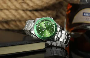 Detail view of Winner automatic mechanical watch with green dial and steel band.