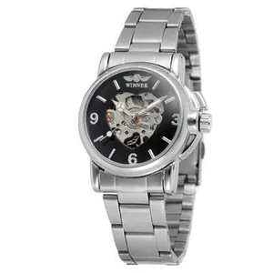 Close-up of heart skeleton dial on silver steel band automatic mechanical watch for women