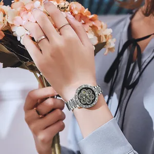 Elegant women's silver automatic mechanical watch with skeletal heart dial and crystals