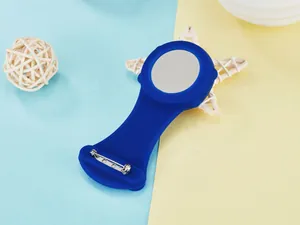 Detailed back view of a blue silicone nurse FOB watch cover with safety pin attachment