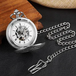 Close-up of vintage silver mechanical pocket watch with skeleton dial and Roman numerals