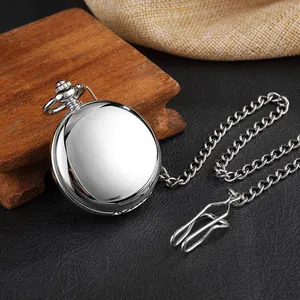 Close-up of a polished silver vintage mechanical pocket watch with a classic chain link