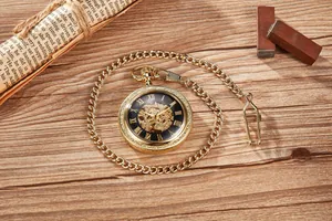 Close-up of vintage golden mechanical pocket watch with hollow Roman numeral dial