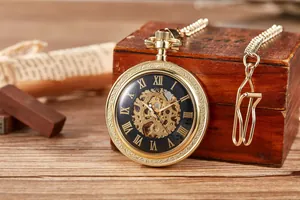 Macro view of vintage mechanical skeleton pocket watch with golden case and Roman numerals