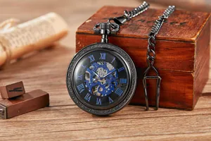 Detail shot of vintage mechanical pocket watch with blue skeleton movement and Roman numerals