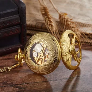 Detailed view of a golden skeleton mechanical pocket watch with ornate engravings.