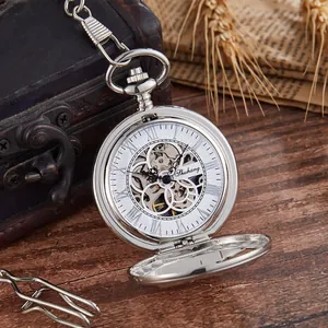 Detailed macro view of a silver skeleton mechanical pocket watch with Roman numerals