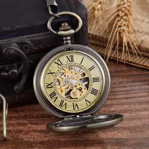 Close-up of vintage bronze skeleton mechanical pocket watch with Roman numerals dial
