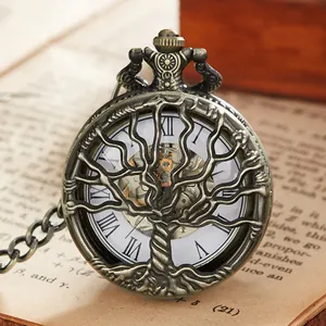 Detailed view of bronze vintage mechanical pocket watch with hollow tree of life cover