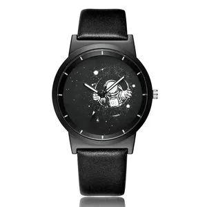 Close-up of minimalist astronaut cartoon illustration on a black quartz watch dial
