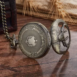 Vintage bronze mechanical pocket watch with hollowed elk design and ornate engraving.