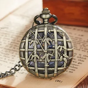 Close-up of vintage bronze pocket watch with hollow bamboo leaf cover design