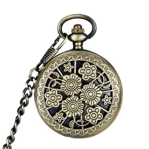 Vintage bronze mechanical pocket watch featuring a hollow floral carving design and chain.