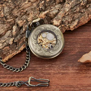 Vintage engraved mechanical pocket watch with hollow floral pattern and bronze chain