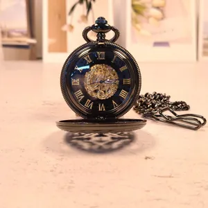 Vintage mechanical pocket watch with engraved hollow design and Roman numerals