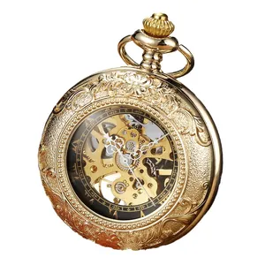 Vintage gold mechanical skeleton pocket watch featuring intricate floral floral engraving