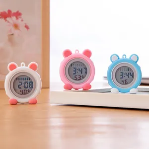 Group of cute cartoon silicone digital nurse watches with luminous displays on wooden desk