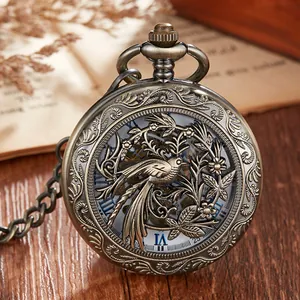 Detailed macro view of vintage hollow-out mechanical pocket watch with bird pattern.