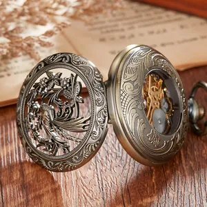 Detailed view of the intricate floral bird carving and mechanical gears of a vintage pocket watch.