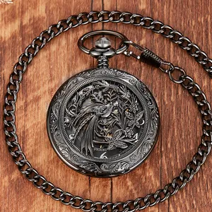 Macro detail view of vintage mechanical pocket watch with bird floral hollow design.