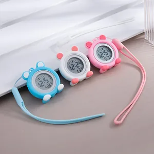 Macro detail view of cute silicone digital nurse watches in blue white and pink colors