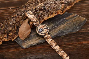 Detailed close-up of a sports watch with desert camouflage silicone strap and dual display
