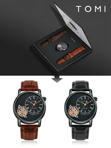 Dettaglio del set regalo orologio al quarzo da uomo TOMI con cinturini in pelle neri e marroni