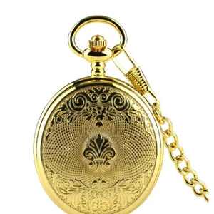Detailed view of classic vintage gold pocket watch featuring intricate floral engravings